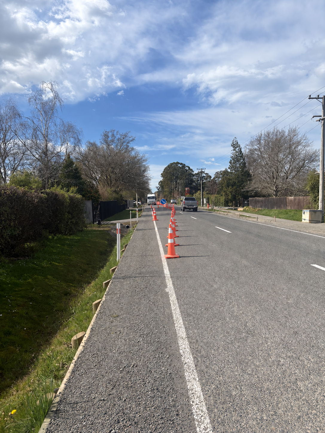 Traffic cones forming a controlled taper on a New Zealand road
